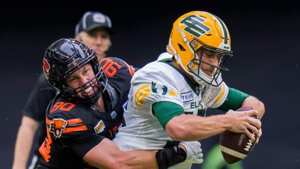 Jun 17, 2023; Vancouver, British Columbia, CAN; BC Lions defensive lineman Mathieu Betts (90) sacks Edmonton Elks quarterback Taylor Cornelius (15) in the second half at BC Place. BC won 22-0. Mandatory Credit: Bob Frid-USA TODAY Sports  